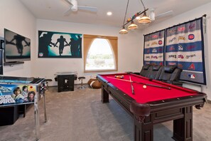 Gameroom with full-sized cocktail table arcade games, pinball, pool table, TVs