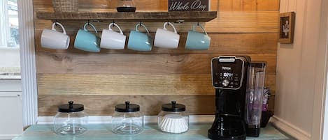 Coffee bar with a coffee pot, coffee grinder, and more!
