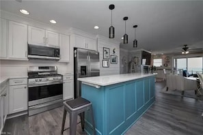 A chef's dream kitchen! Gas range, quartz counters & Stainless Steel appliances.