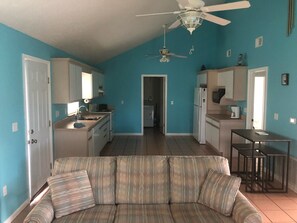 Kitchen from the living room; door on left leads to deck with outside seating