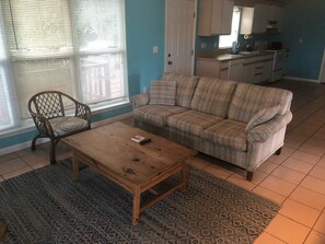 Living room, camera facing toward kitchen