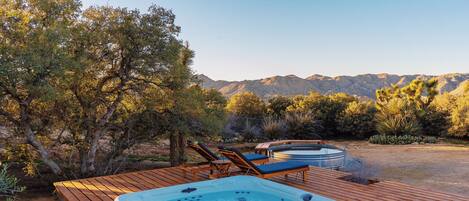 Your private oasis with hot tub, lounge chairs and stunning desert mountain views