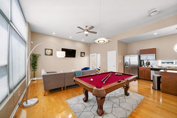 Full-size pool table included.