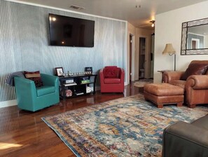 Large living room with electric reclining couch to enjoy this 60" TV
