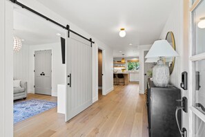 Entry way looking towards 4th bedroom/den and powder bath (both on the left)