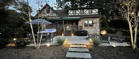 Back patio includes fire pit, hot tub, Blackstone grill, and outdoor table.