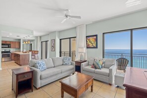 Living room with comfortable couch that converts into a sleeper sofa + loveseat for additional seating!