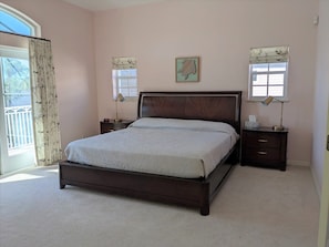 Master bedroom with king sized bed and two closets. Private bath. 
