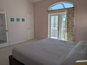 Master bedroom looking toward upper level veranda.