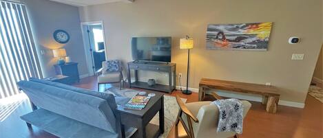 The layout is open and modern, with comfortable furniture and modern décor