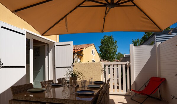Terrace with parasol, electric grill, outdoor bar and solar shower