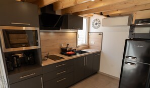 Fully equipped kitchen with dishwasher, fridge, freezer and microwave