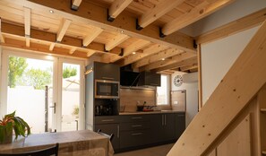 Kitchen opening onto living/dining room