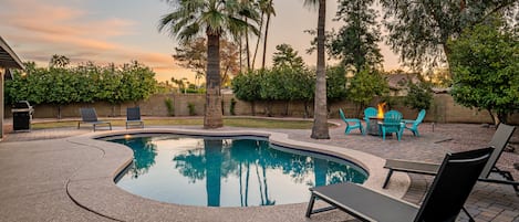 Lovely Arizona backyard with lounging areas and a beautiful pool.