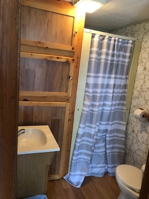 Full bathrooms include shower, toilet, vanity, and fresh towels.