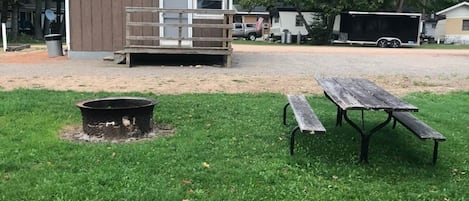 Quaint cottage with small porch area. Only a few steps makes for easy access.