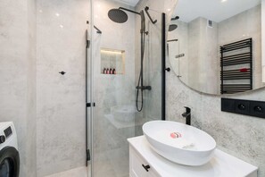 The bathroom offers a clean and functional space for your stay. 