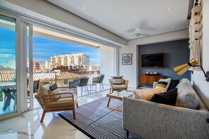 Spacious living room with smart TV and panoramic view