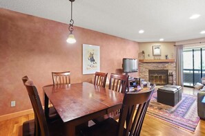 The spacious dining table seats six and provides the perfect bridge between the kitchen and living room. Set up a game, tackle a puzzle or enjoy a meal fresh out of the kitchen - you can do it all here.