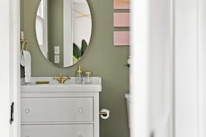 The bathroom has plenty of storage to keep your things close at hand but not in the way.