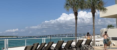 Pool, fitness, balcony next to the pool & gas grills 