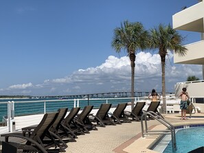 Pool, fitness, balcony next to the pool & gas grills 