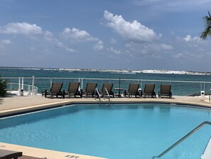 Chairs to watch the boats and traffic with umbrellas from the pool.