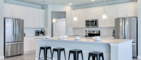 Kitchen area with stainless steel appliances and spacious island