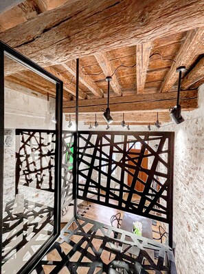 Platform to the bedroom with hand-forged metal balustrades