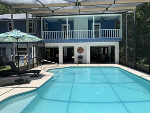 Pool area fully equipped with two tables, chairs, towels and Cabana,