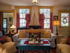 Wrap yourselves up with a throw blanket and cozy up on the couch.  It's such a cheerful room!