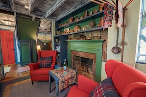 I love this fireplace in the kitchen and all the historical little treasures on the shelves. Feel free to pick things up and touch them! I wouldn't be able to help myself either! 
**Note: Fireplaces throughout the Williams Home are decorative only.**