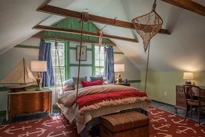 On the other side of the attic, opposite the queen sleeper sofa, is our 4th "bedroom area" offering a super comfy queen-bed suspended from ropes! NOTE: The two areas have a partial wall between them but no door- great as a shared family space.