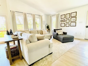 Main level living area has Fire TV, propane fireplace, games and puzzles.