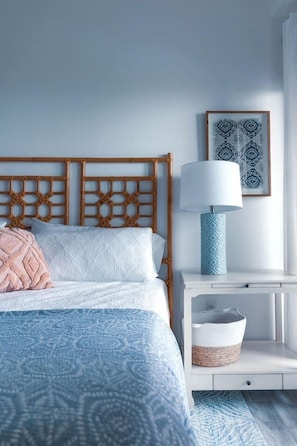 Indulge in comfort: King bed, balcony with dune and Gulf views, ensuite bath with jacuzzi tub and shower.