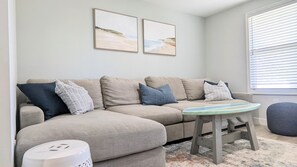 Living room sectional and surfboard coffee table