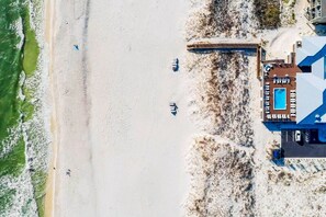 Steps from the beach! Enjoy breathtaking ocean views and easy access to the sand from this stunning beachfront property.