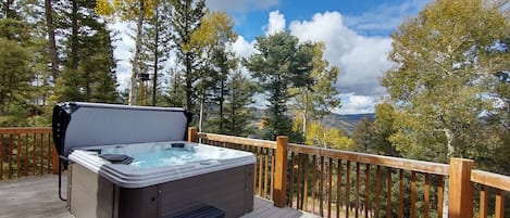 Hot tub sits on the deck right off the great room