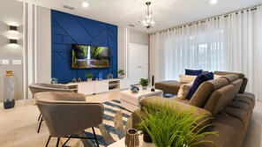 Enjoy quality time with loved ones in our inviting living room, offering a cozy space for relaxation.
