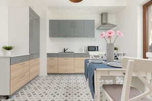 The fully equipped kitchenette includes everything you need for a home-cooked meal.