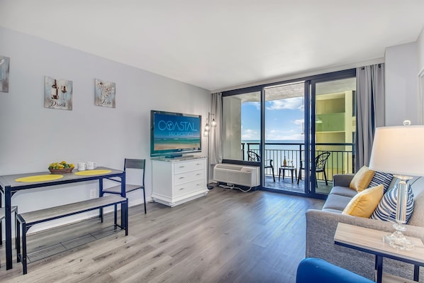 Embrace seaview elegance in our suite's living area, ensuring a luxurious stay with panoramic ocean scenes!