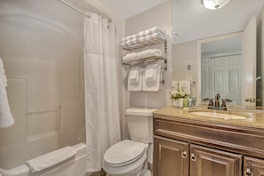 Discover refreshing simplicity in our bathroom, with a refreshing bathtub, a functional sink, and a toilet, providing a straightforward and revitalizing space!