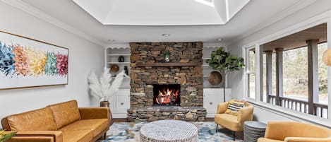 Stunning living room filled with natural light by skylight