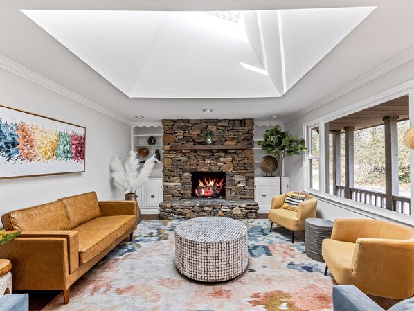 Stunning living room filled with natural light by skylight