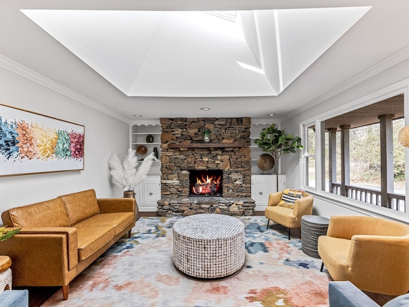 Stunning living room filled with natural light by skylight