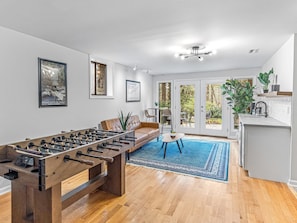 Lower Level: rec room with foosball table, chic kitchenette, and space to entertain