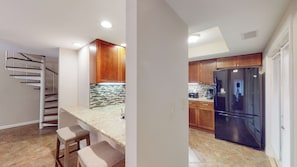 Fully Stocked Kitchen with Pass-Through Window