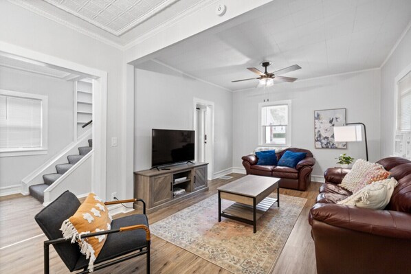 Living room, front of property and driveway seen through window