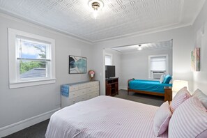 Bright, airy second bedroom has a full and twin bed, great for children or adults with a child