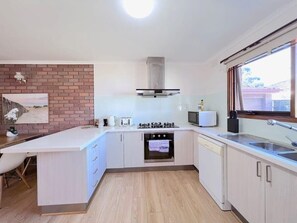 Spacious open kitchen with pantry